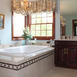 Master Bathroom With Granite Tub Surround and Countertops